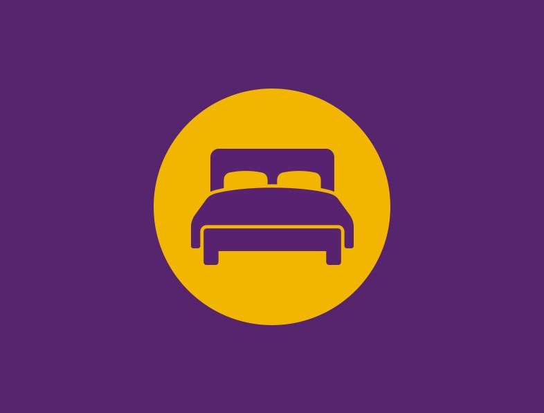Luxuriöses Bett-Icon auf lila Hintergrund für stilvolle Schlafzimmer-Inspiration.