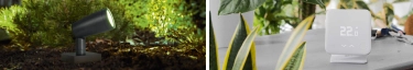 Moderne Gartenbeleuchtung und smartes Thermostat für energieeffizientes Wohnen.
